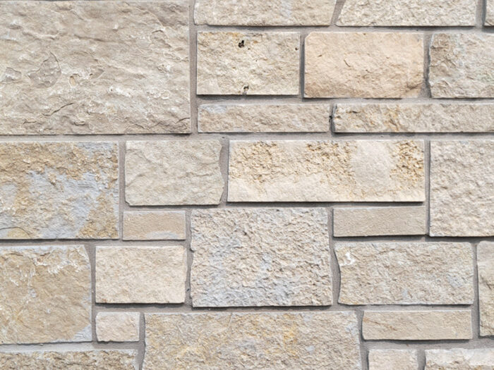 closeup of weston cream dimensional natural stone veneer display with restoration mortar